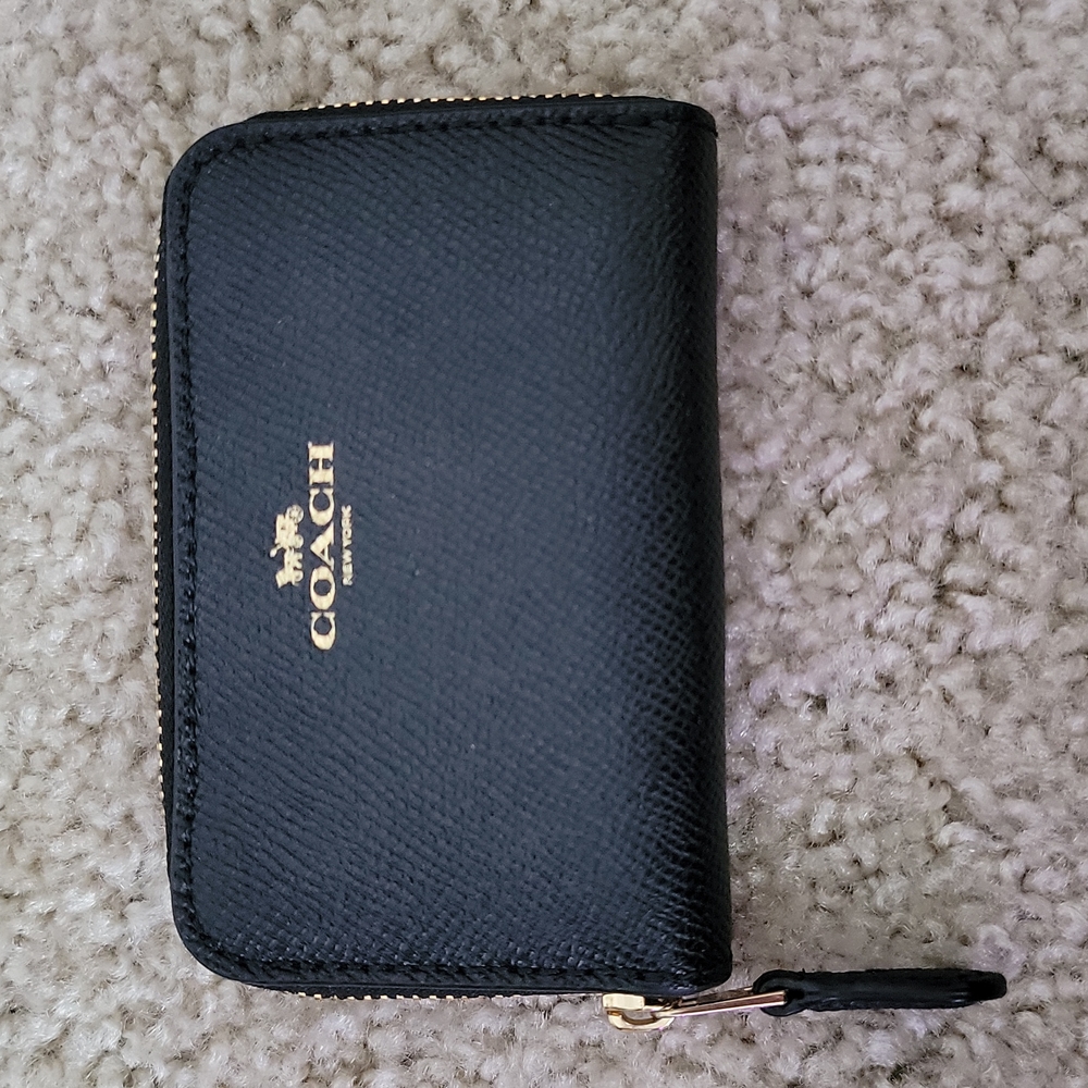 NWOT Coach mini zip up wallet.